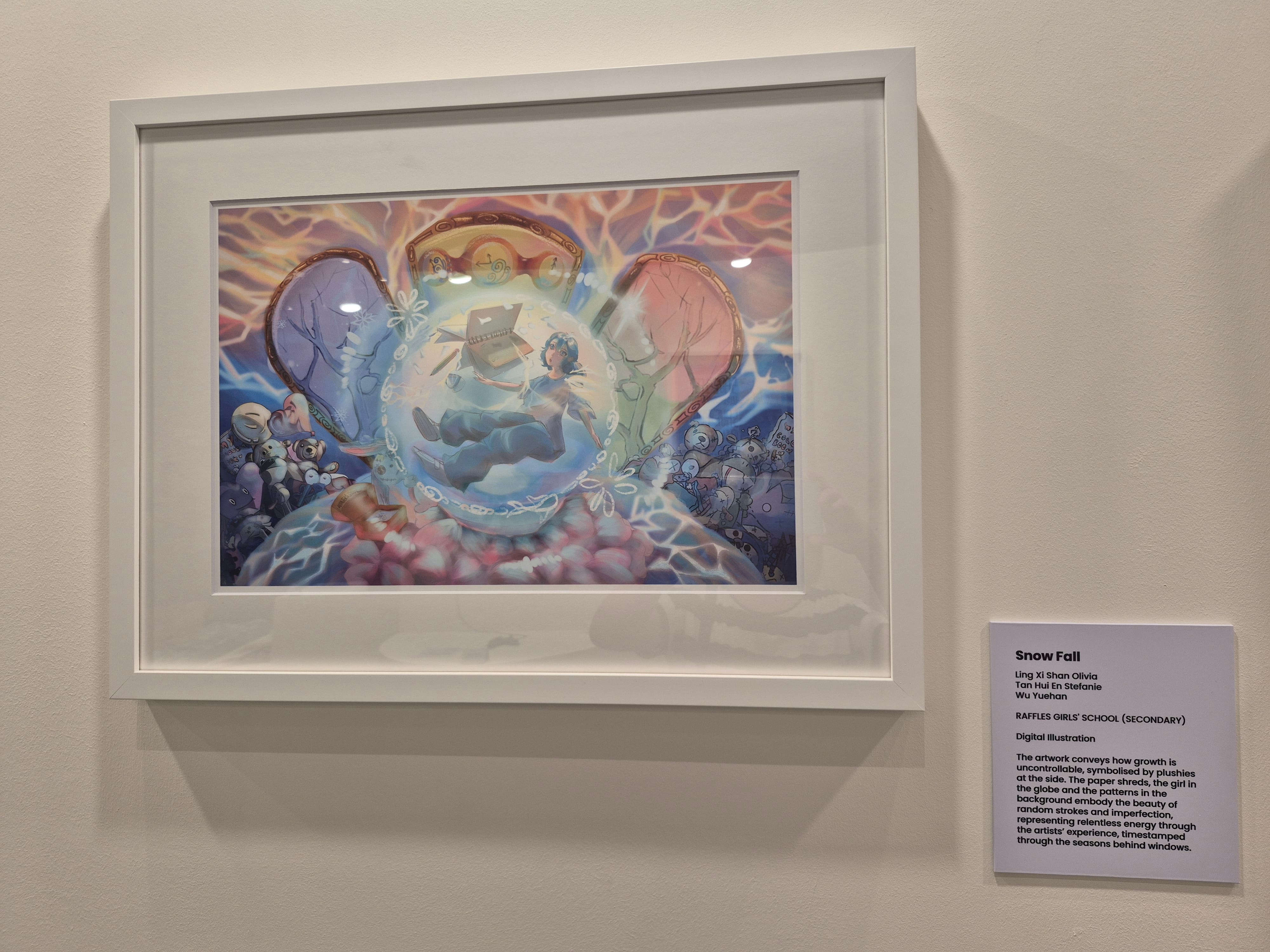 A closeup of a framed artwork in pastel colours.